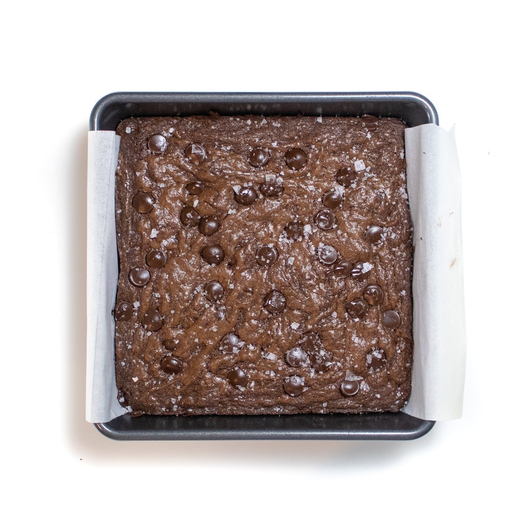 A big tray of brownies against a white background.