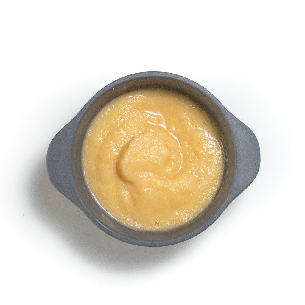 A gray baby bowl with puréed cauliflower, cantaloupe in minutes.