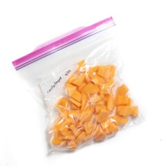 Frozen cantaloupe in a Ziploc bag.