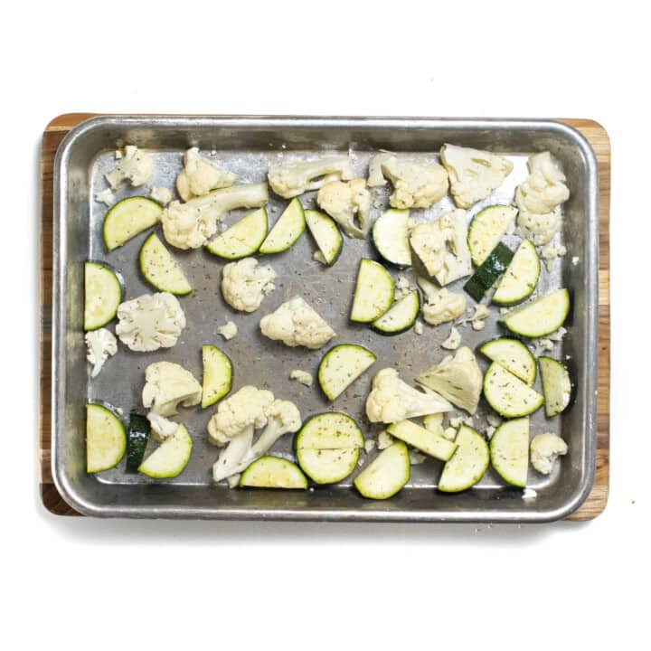 A baking sheet with roasted cauliflower and zucchini for baby food.