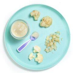 A teal plate showing how to feed cauliflower to your baby, as a purée or for baby led weaning.