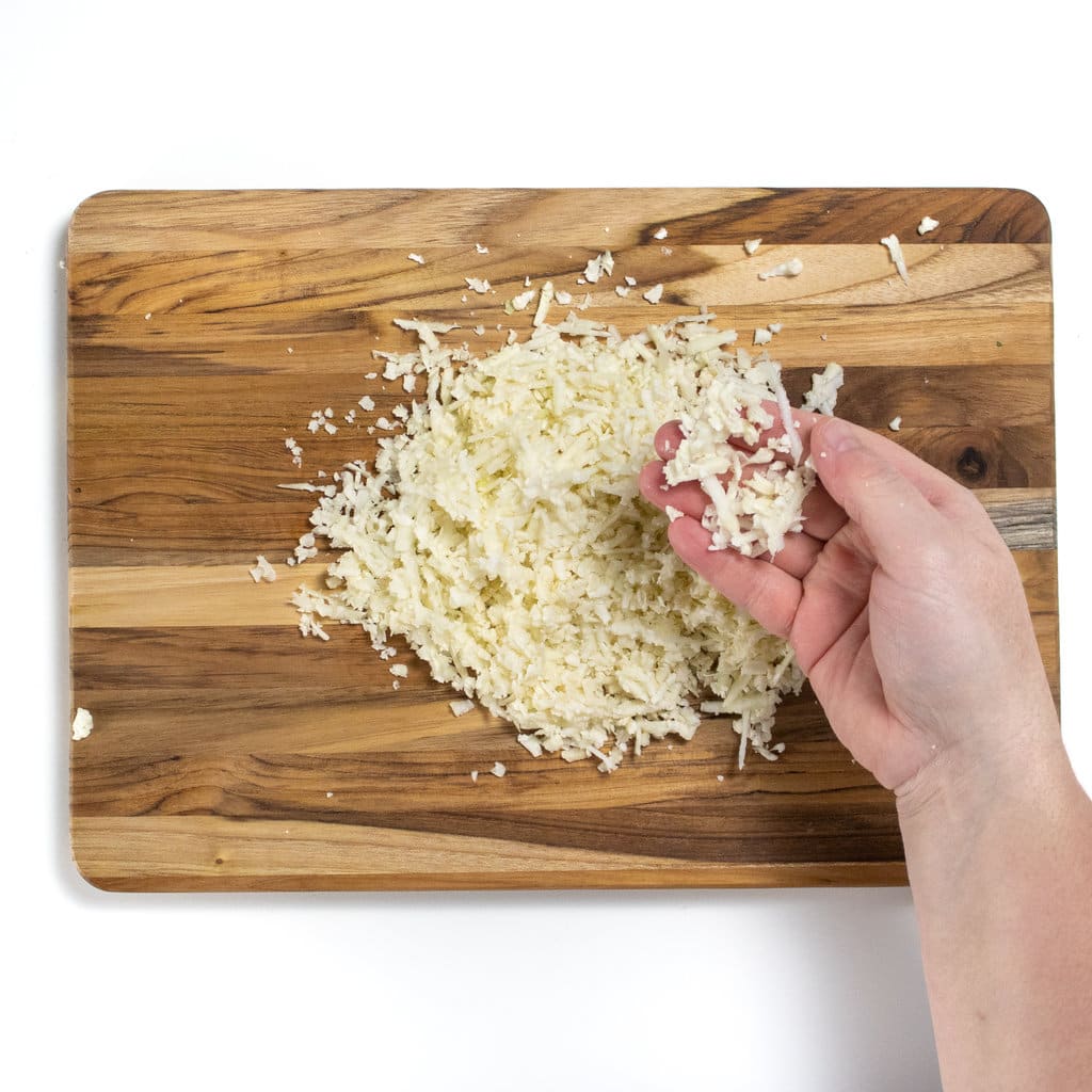 I wouldn't cutting board there's a pile of cauliflower rice.