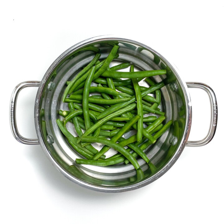 Steamer filled with fresh green beans.