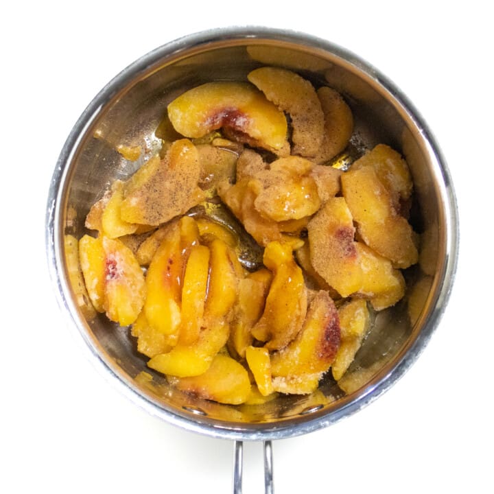I hate silversmiths pan with frozen peaches, maple syrup and nutmeg.