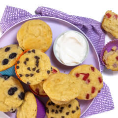 Yogurt muffins on a purple plate with a purple napkin.