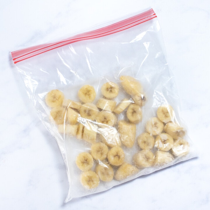 A bag full of sliced bananas ready to be put in the freezer.