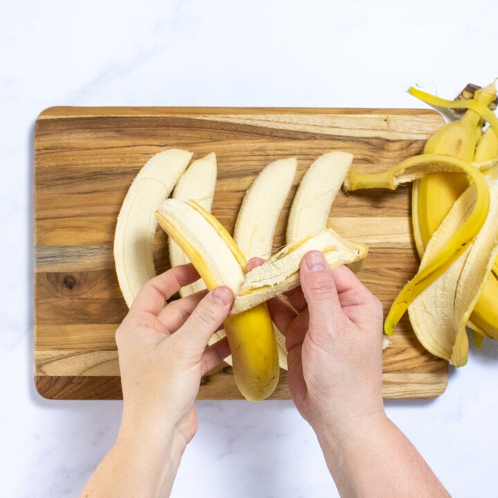 It wouldn't cutting board with hands peeling bananas.
