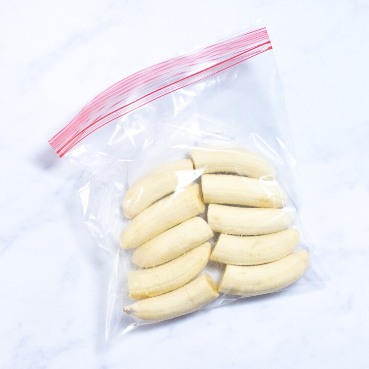 A bag full of cut banana halves without the peels.