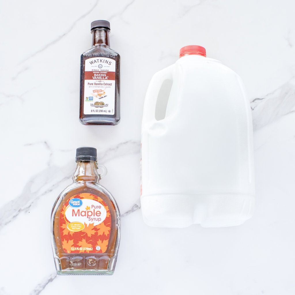 Ingredients for vanilla milk – milk, maple syrup and vanilla extract any marble countertop.