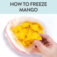 Graphic for post Dash how to freeze may go. Images of a hand holding a chunk of frozen mango out of a Ziploc bag of frozen mango on a white background.