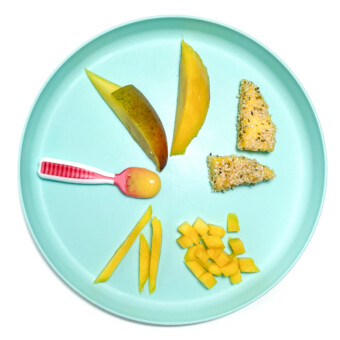 blue plate with several different ways to serve mango to your baby.