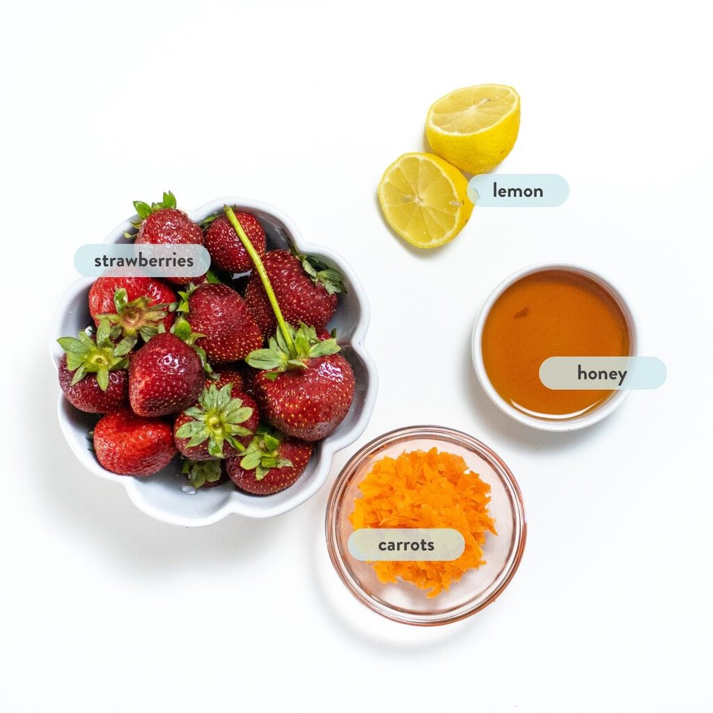 spread of ingredients for strawberry popsicles on a white background with text saying which each item is. 
