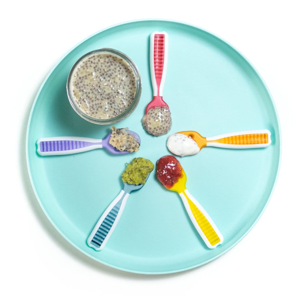Blue baby plate with different colored baby spoons showing different ways to serve chia seeds.