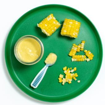 A green kids plate with corn for baby on it shown how to serve it different ways.