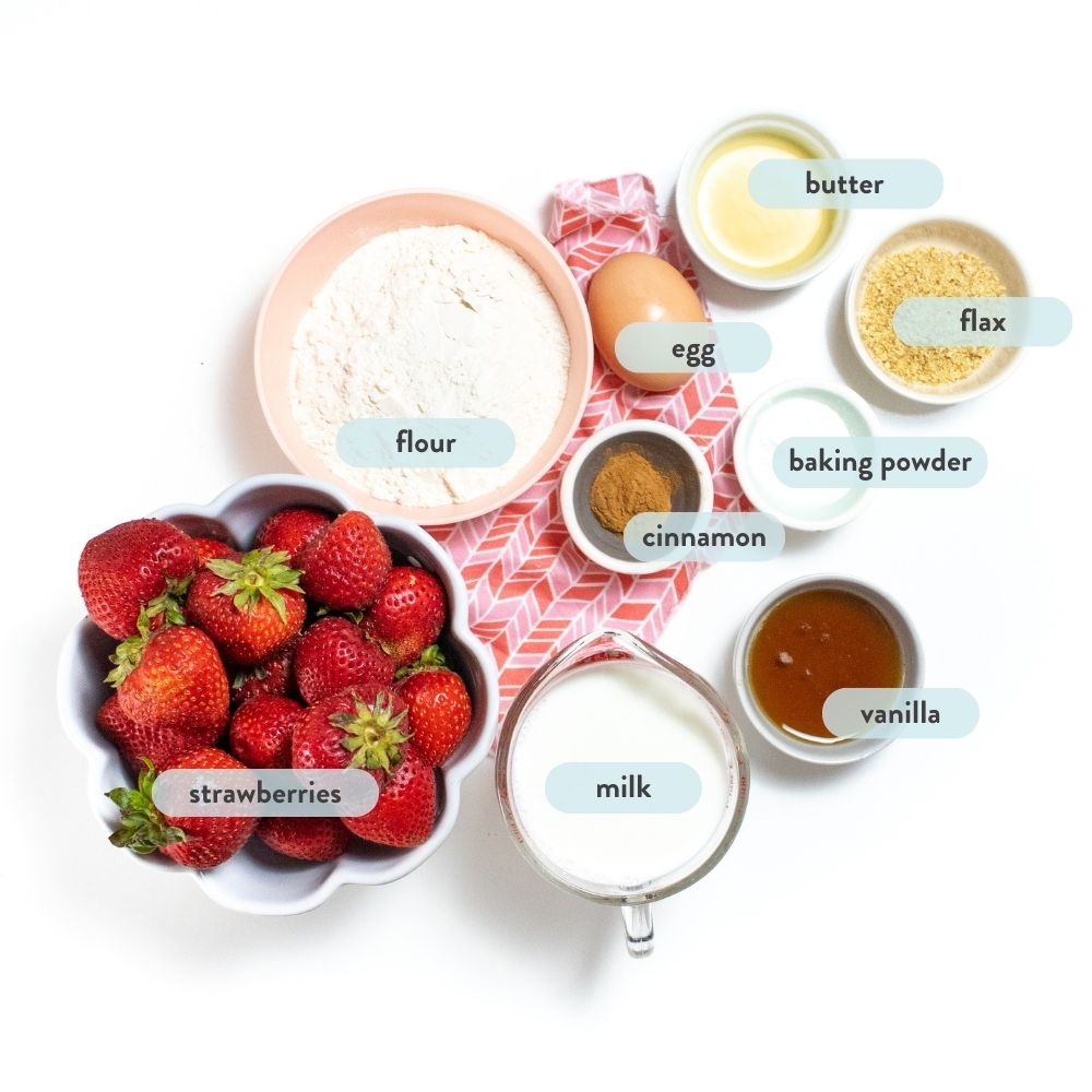 Spread of ingredients on a white countertop with ingredients in a bowl