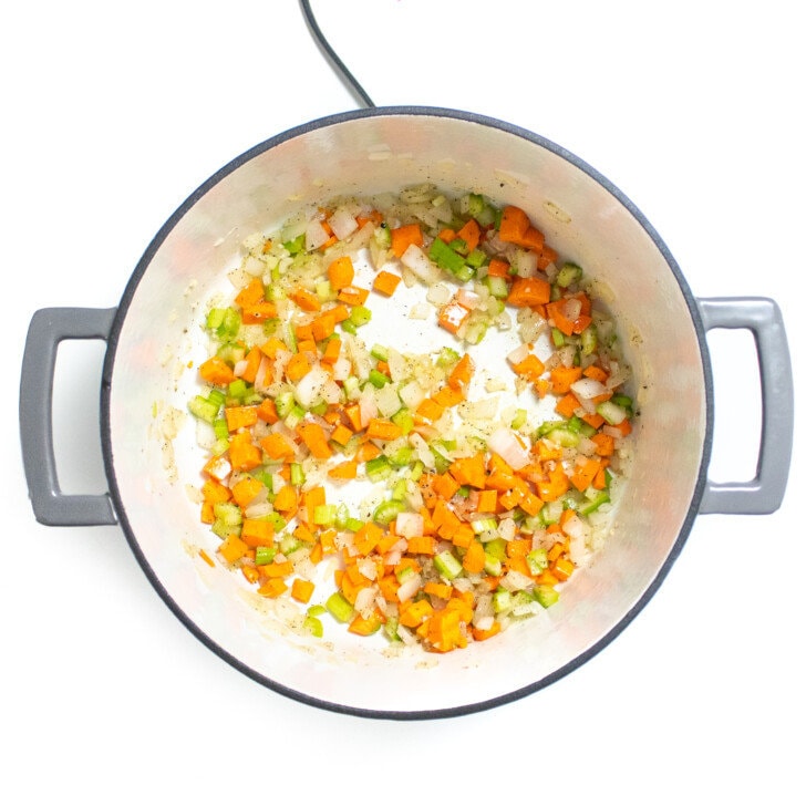 a gray start pod, fall of cooked onion, carrots, celery, and garlic.
