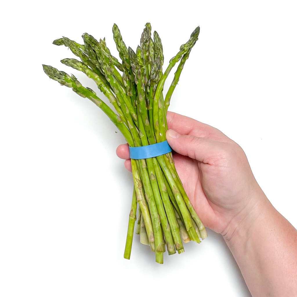 Bunch of asparagus against the way background.