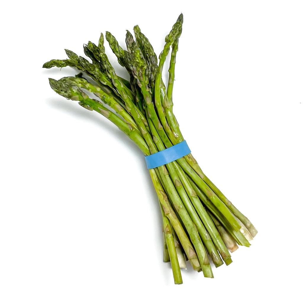 A bunch of asparagus spears with a blue rubber band, on the way background.