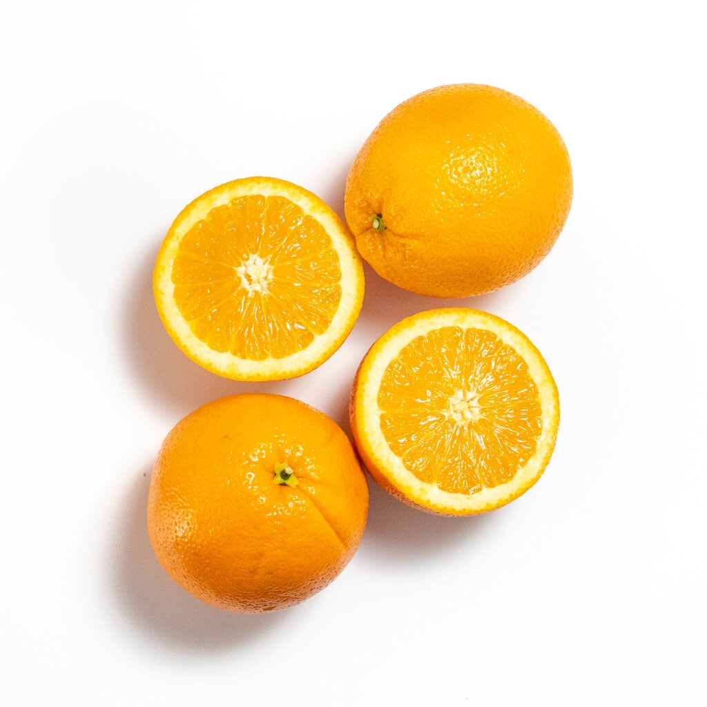 Oranges on a white countertop.