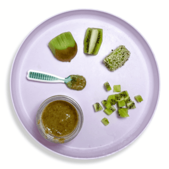 Purple baby plate with kiwi cut and pureed in different ways showing how you can serve it at different ages and stages.